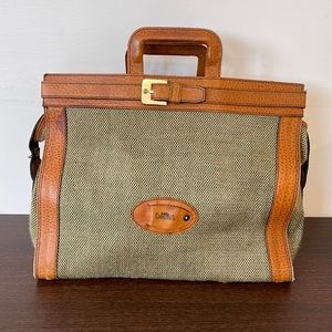 Leather and cloth travel handbag